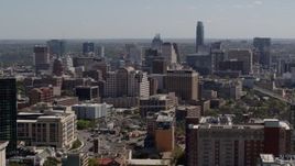 5.7K aerial stock footage of a reverse view of the capitol and office buildings, and city skyline in Downtown Austin, Texas Aerial Stock Footage | DX0002_108_011