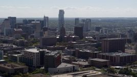 5.7K aerial stock footage of the Texas State Capitol near skyscrapers in Downtown Austin, Texas Aerial Stock Footage | DX0002_108_021