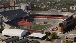 5.7K aerial stock footage of a view of the empty football stadium at the University of Texas, Austin, Texas Aerial Stock Footage | DX0002_108_023