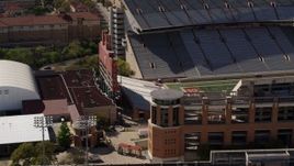 5.7K aerial stock footage orbit scoreboard at the empty football stadium at the University of Texas, Austin, Texas Aerial Stock Footage | DX0002_108_027