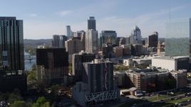 5.7K aerial stock footage of towering city skyline while flying between high-rise and hotel in Downtown Austin, Texas Aerial Stock Footage | DX0002_108_043