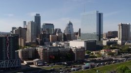 5.7K aerial stock footage of flying by a hotel with a view of the city's skyline in Downtown Austin, Texas Aerial Stock Footage | DX0002_108_047