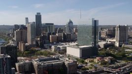 5.7K aerial stock footage of a high-rise hotel and the city's skyline in Downtown Austin, Texas Aerial Stock Footage | DX0002_108_049