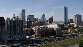 5.7K aerial stock footage of the city's skyline and high-rise hotel seen from freeway in Downtown Austin, Texas Aerial Stock Footage | DX0002_108_051