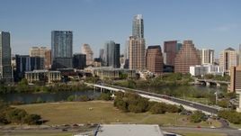 5.7K aerial stock footage of the city's skyline on the opposite side of Lady Bird Lake seen from bridge, Downtown Austin, Texas Aerial Stock Footage | DX0002_109_003