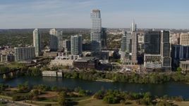 5.7K aerial stock footage modern skyscraper across Lady Bird Lake, Downtown Austin, Texas Aerial Stock Footage | DX0002_109_005