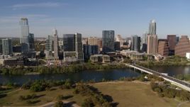 5.7K aerial stock footage of the city's waterfront skyline on the other side of Lady Bird Lake, Downtown Austin, Texas Aerial Stock Footage | DX0002_109_014