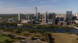 5.7K aerial stock footage of skyscrapers in the city's waterfront skyline on the other side of Lady Bird Lake, Downtown Austin, Texas Aerial Stock Footage | DX0002_109_016