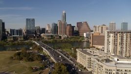 5.7K aerial stock footage ascend for view of the city's waterfront skyline, seen from apartment building and hotel, Downtown Austin, Texas Aerial Stock Footage | DX0002_109_020