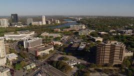 5.7K aerial stock footage reverse view Lady Bird Lake, seen while flying near office building, Austin, Texas Aerial Stock Footage | DX0002_109_025
