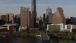 5.7K aerial stock footage of the Texas State Capitol seen between skyscrapers in Downtown Austin, Texas Aerial Stock Footage | DX0002_109_029