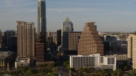 5.7K aerial stock footage flyby downtown skyscrapers and reveal the state capitol in Downtown Austin, Texas Aerial Stock Footage | DX0002_109_033