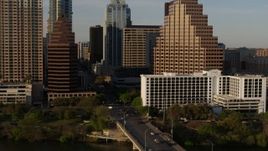 5.7K aerial stock footage of downtown skyscrapers during descent, reveal bridge in Downtown Austin, Texas Aerial Stock Footage | DX0002_109_037