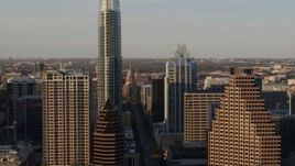 5.7K aerial stock footage flying by skyscrapers to reveal Texas State Capitol in Downtown Austin, Texas Aerial Stock Footage | DX0002_109_041