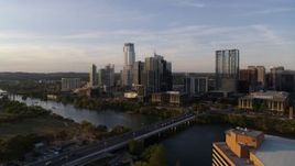 5.7K aerial stock footage the city's waterfront skyline and Lady Bird Lake at sunset in Downtown Austin, Texas Aerial Stock Footage | DX0002_110_001