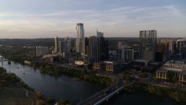 5.7K aerial stock footage a wide orbit of the city's waterfront skyline and Lady Bird Lake at sunset in Downtown Austin, Texas Aerial Stock Footage | DX0002_110_002