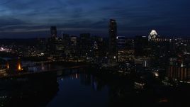 5.7K aerial stock footage a reverse view of waterfront skyline, seen from Lady Bird Lake at twilight in Downtown Austin, Texas Aerial Stock Footage | DX0002_111_005