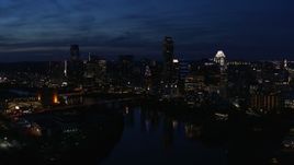 5.7K aerial stock footage of the waterfront skyline on the shore of Lady Bird Lake at twilight in Downtown Austin, Texas Aerial Stock Footage | DX0002_111_006