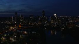5.7K aerial stock footage of the city's waterfront skyline on the shore of Lady Bird Lake at twilight in Downtown Austin, Texas Aerial Stock Footage | DX0002_111_007
