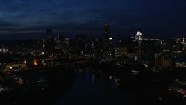 5.7K aerial stock footage passing by waterfront skyline on the shore of Lady Bird Lake at twilight in Downtown Austin, Texas Aerial Stock Footage | DX0002_111_011