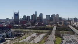 5.7K aerial stock footage a reverse view of city's skyline near the river in Downtown Nashville, Tennessee Aerial Stock Footage | DX0002_112_002