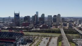 5.7K aerial stock footage of the city's skyline seen while ascending near football stadium in Downtown Nashville, Tennessee Aerial Stock Footage | DX0002_112_007