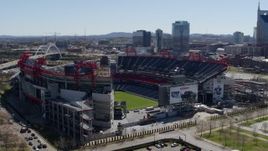 5.7K aerial stock footage of orbiting the football stadium with view of the field in Nashville, Tennessee Aerial Stock Footage | DX0002_112_010