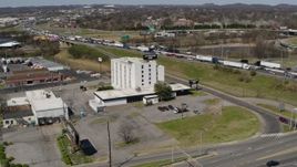 5.7K aerial stock footage of orbiting a hotel by the freeway in Nashville, Tennessee Aerial Stock Footage | DX0002_112_012