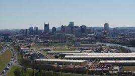 5.7K aerial stock footage a wide view of the city's skyline seen from warehouse buildings in Downtown Nashville, Tennessee Aerial Stock Footage | DX0002_112_014