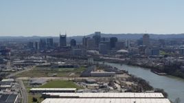 5.7K aerial stock footage a wide view of the city's skyline by the Cumberland River in Downtown Nashville, Tennessee Aerial Stock Footage | DX0002_112_016