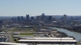 5.7K aerial stock footage a wide view of the city's riverfront skyline and Cumberland River in Downtown Nashville, Tennessee Aerial Stock Footage | DX0002_112_017