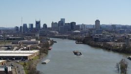 5.7K aerial stock footage a wide view of the city's skyline seen from near barge on the river in Downtown Nashville, Tennessee Aerial Stock Footage | DX0002_112_019