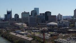 5.7K aerial stock footage of the city's skyline across the Cumberland River, Downtown Nashville, Tennessee Aerial Stock Footage | DX0002_112_034