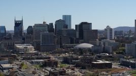 5.7K aerial stock footage of ascending near the city's skyline, Downtown Nashville, Tennessee Aerial Stock Footage | DX0002_112_035