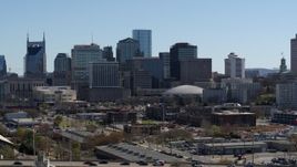 5.7K aerial stock footage of descending near the city's skyline, Downtown Nashville, Tennessee Aerial Stock Footage | DX0002_112_036