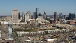 5.7K aerial stock footage ascend for view of city's skyline behind apartment buildings in Downtown Nashville, Tennessee Aerial Stock Footage | DX0002_113_020