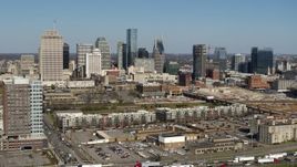 5.7K aerial stock footage descend for view of city's skyline behind apartment buildings in Downtown Nashville, Tennessee Aerial Stock Footage | DX0002_113_021