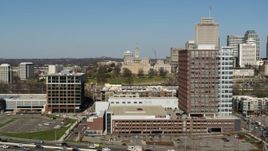 5.7K aerial stock footage approach and ascend by office buildings in Nashville, Tennessee Aerial Stock Footage | DX0002_113_029