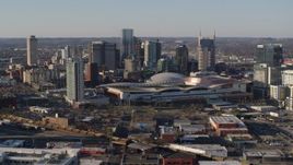 5.7K aerial stock footage of passing by the convention center and skyline in Downtown Nashville, Tennessee Aerial Stock Footage | DX0002_114_016