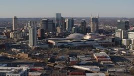 5.7K aerial stock footage of flying by the convention center and skyline before descent in Downtown Nashville, Tennessee Aerial Stock Footage | DX0002_114_017