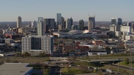 5.7K aerial stock footage of the city skyline behind the convention center in Downtown Nashville, Tennessee Aerial Stock Footage | DX0002_114_019