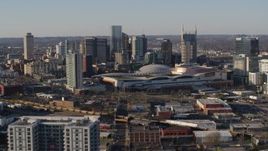 5.7K aerial stock footage approach the city skyline behind the convention center in Downtown Nashville, Tennessee Aerial Stock Footage | DX0002_114_021