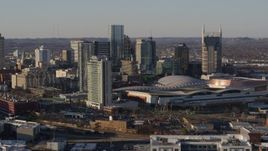 5.7K aerial stock footage descent, and stationary view of city skyline and the convention center in Downtown Nashville, Tennessee Aerial Stock Footage | DX0002_114_031