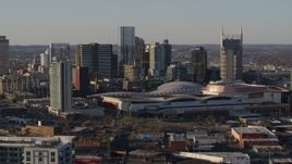 5.7K aerial stock footage descending with view of city skyline and the convention center in Downtown Nashville, Tennessee Aerial Stock Footage | DX0002_114_033