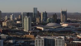 5.7K aerial stock footage reverse view of city's tall skyline beside Nashville Music City Center in Downtown Nashville, Tennessee Aerial Stock Footage | DX0002_114_040