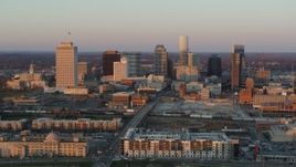 5.7K aerial stock footage of the city's skyline at sunset before descending in Downtown Nashville, Tennessee Aerial Stock Footage | DX0002_115_001