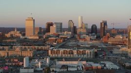 5.7K aerial stock footage of flying by the city's skyline at sunset in Downtown Nashville, Tennessee Aerial Stock Footage | DX0002_115_002