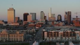5.7K aerial stock footage approach Church Street, then ascend for view of the city's skyline at sunset in Downtown Nashville, Tennessee Aerial Stock Footage | DX0002_115_008