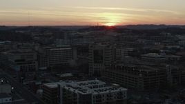 5.7K aerial stock footage a hospital complex with view of setting sun, seen during descent and orbit, Nashville, Tennessee Aerial Stock Footage | DX0002_115_018