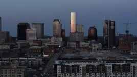 5.7K aerial stock footage ascend with a view of the city's skyline at twilight in Downtown Nashville, Tennessee Aerial Stock Footage | DX0002_115_019